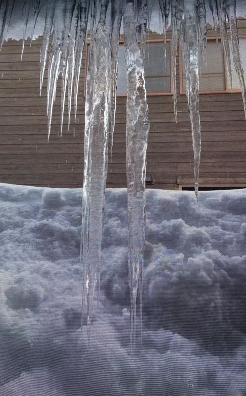 Winter dangers in snow country: Icicles photo