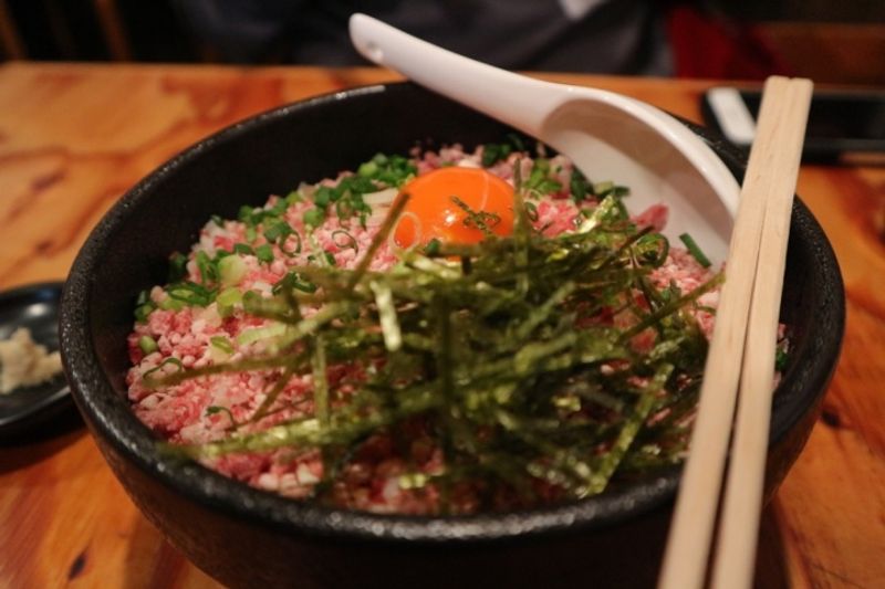 Ground raw beef on rice - Tokachi gyu-toro flake don photo