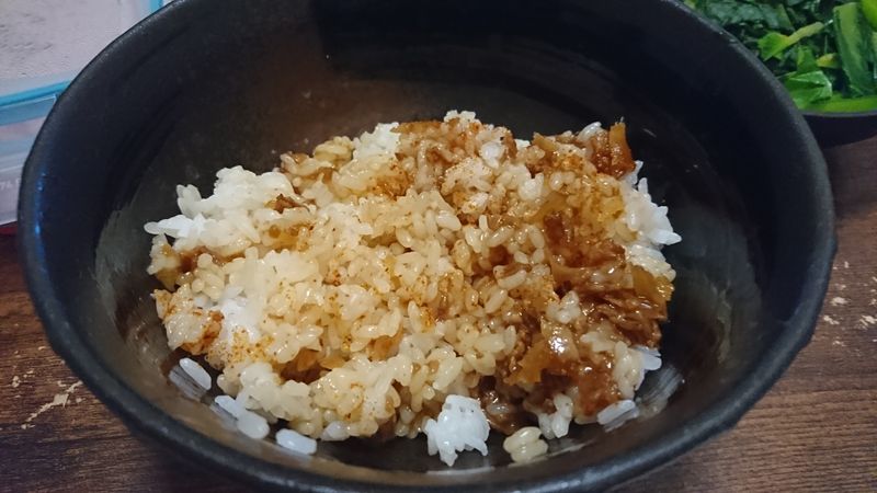 Putting Beef Bukakke Toppings on Rice photo