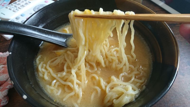 Mixing Raw Eggs into Noodles photo