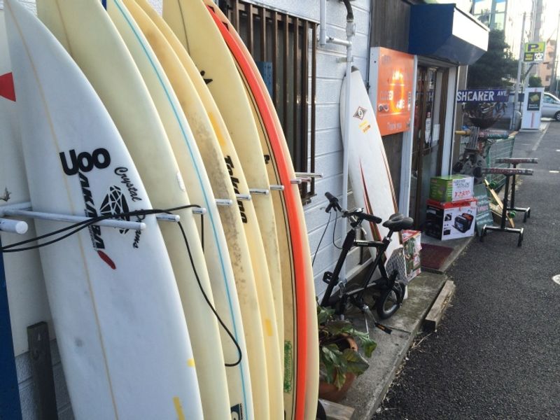 Surf shop in Chiba with a massive dinosaur on the roof! photo