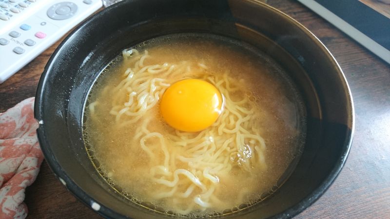 Mixing Raw Eggs into Noodles photo